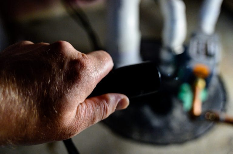 Hand Holding a Sump Pump Handle in Livonia