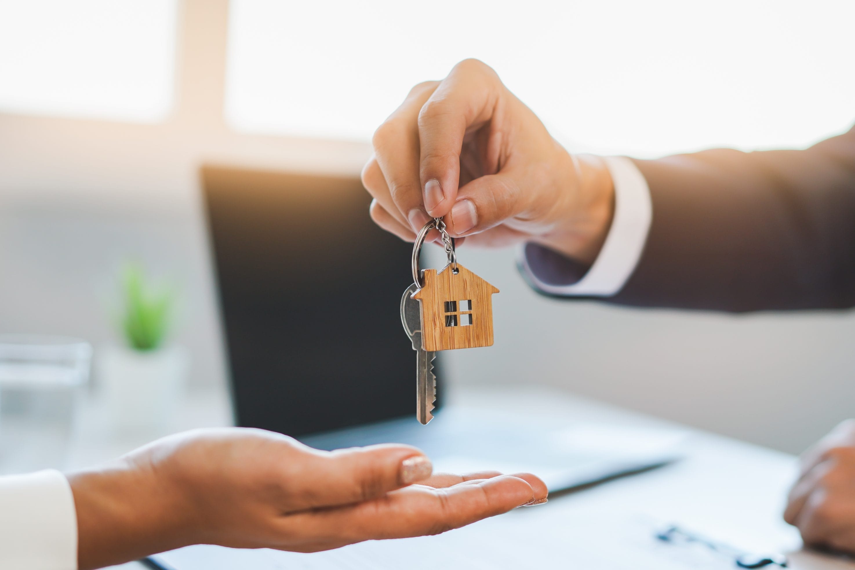 Exchanging House Keys for Real Estate Transaction
