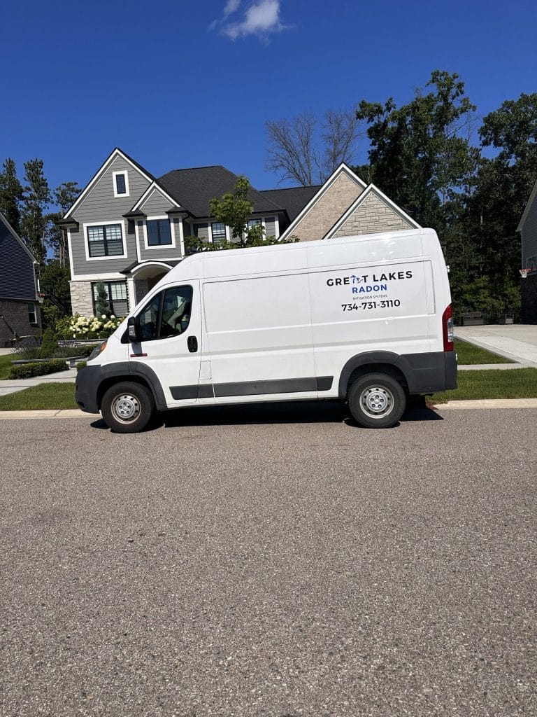 Radon inspection van by Great Lakes Radon at residential area