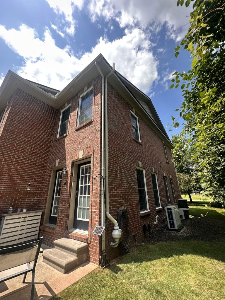 Radon Mitigation System Installed on Red Brick House in Kalamazoo