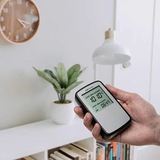 Hand Holding Radon Monitoring Device Indoors